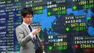 Asian shares mostly lower on uncertainty over trade outlook