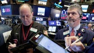 Stocks mixed as traders digest economic data, eye trade developments