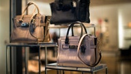 Coach's forecast, quarterly sales miss estimates, shares slip