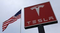 Tesla sticks with Model 3 forecast as earnings top estimates