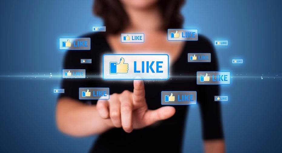 Businesswoman pressing modern social buttons on a virtual background