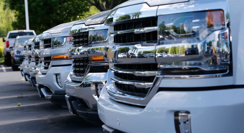 Chevrolet Silverado trucks parked in a row AP FBN