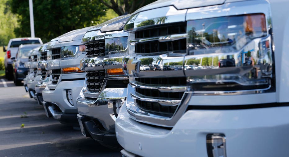 Chevrolet Silverado trucks parked in a row AP FBN