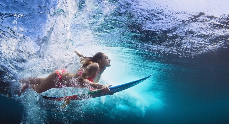 Underwater Photo Of Girl With Board Dive Under Ocean Wave