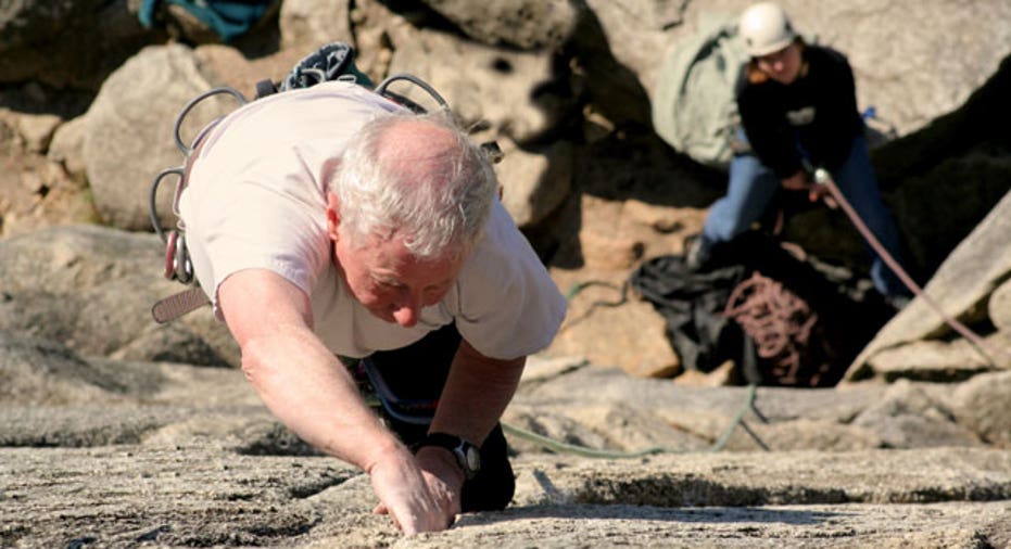 Elderly Man Rock Climbing