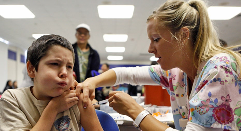 Pediatrician Giving Child Vaccination