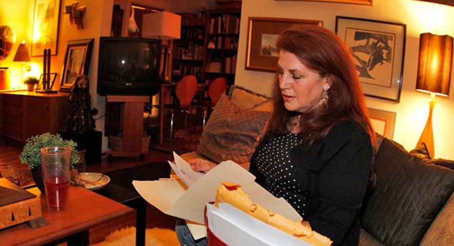 Woman Looking Through Paperwork