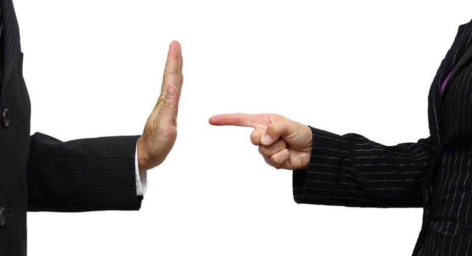 Business Woman Pointing To Coworker. He Refuses Task