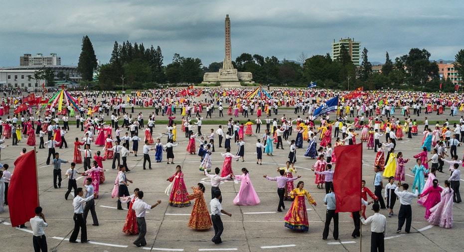 People dance in a square  in North Korea