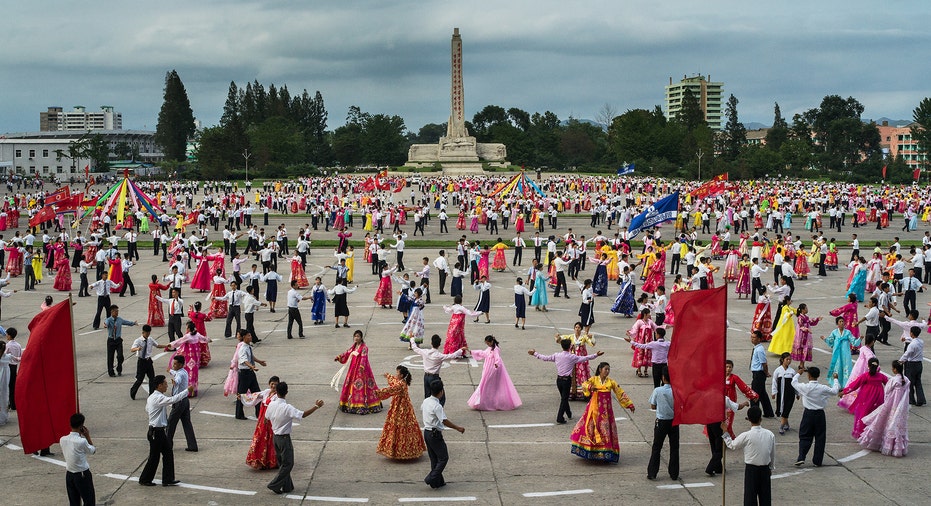 People dance in a square  in North Korea