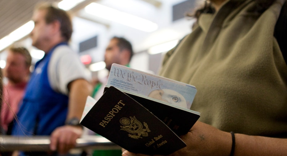 Woman Holds Passports, Reuters