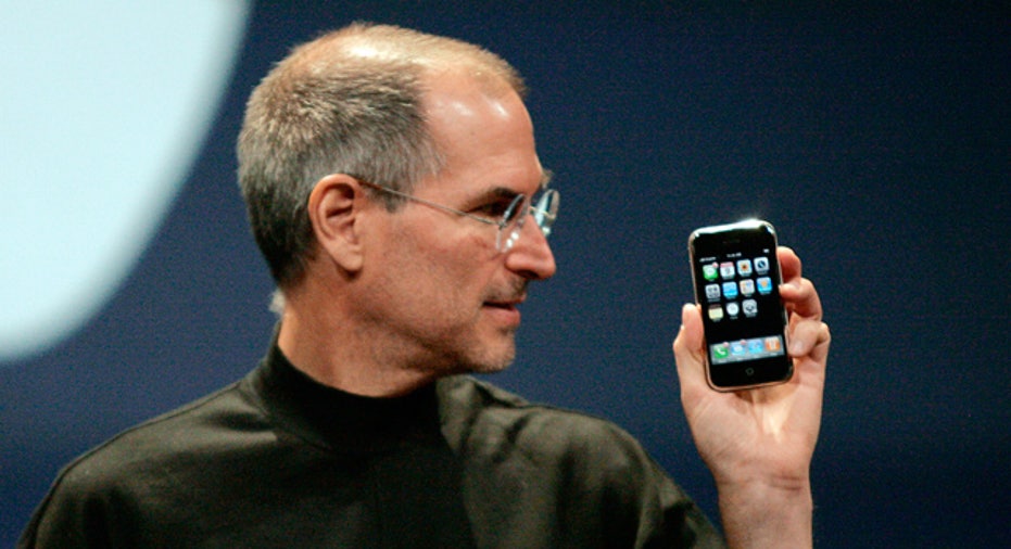 Apple CEO Steve Jobs Looks at iPhone
