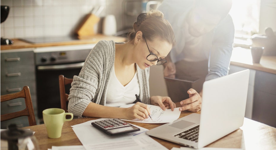 woman paying bills fbn