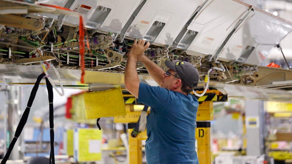worker assembles a Boeing's 737 MAX airplane wing 