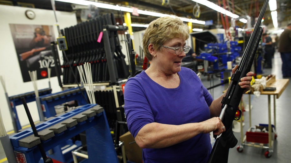 Ruger worker assembling rifle FBN