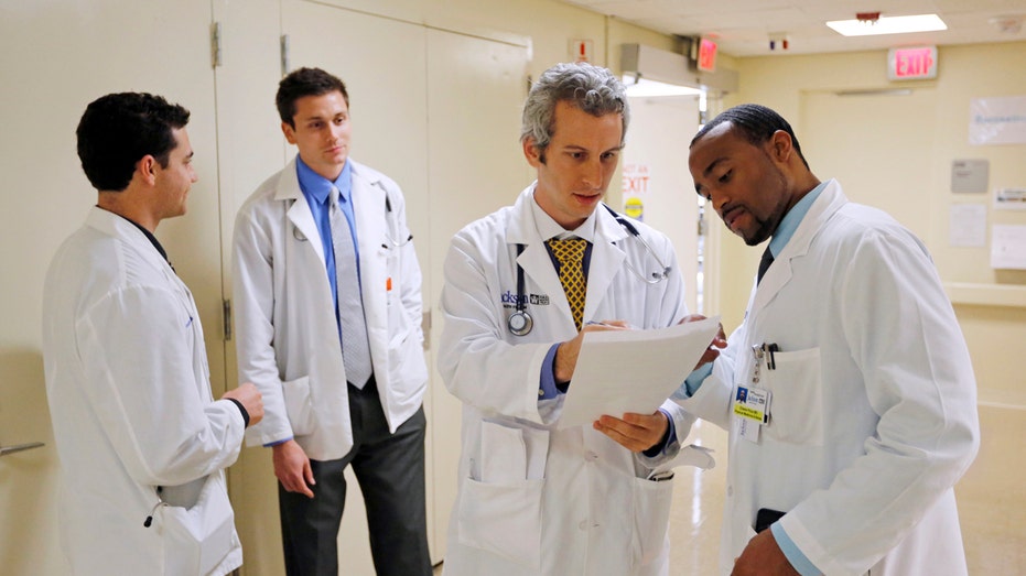 Doctors talking at a hospital.