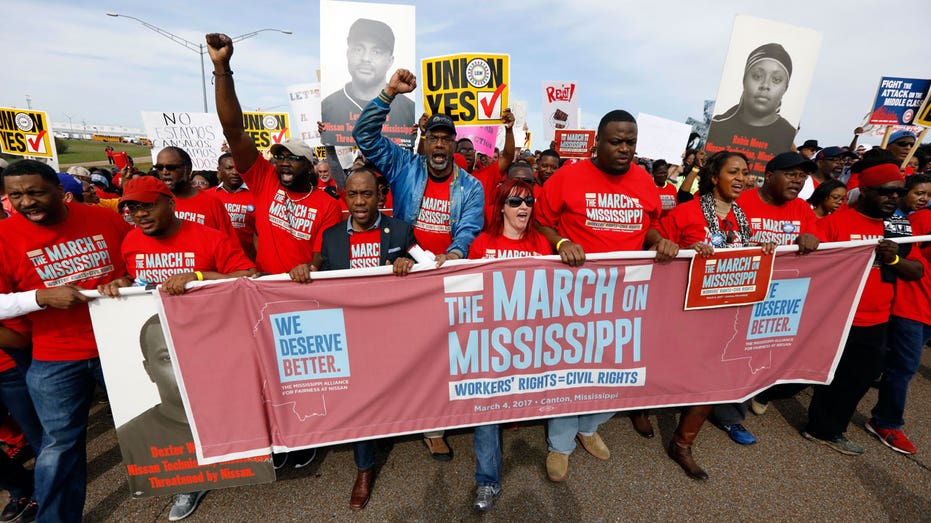 Nissan workers marching FBN AP