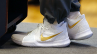 Nike posts loss due to tax law, but beats expectations