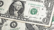 Dollar drifts as soft inflation raises taper timing questions