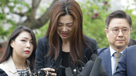 Korean Air heiress apologizes before police questioning