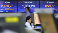 Global stocks mixed on backdrop of US-China talks