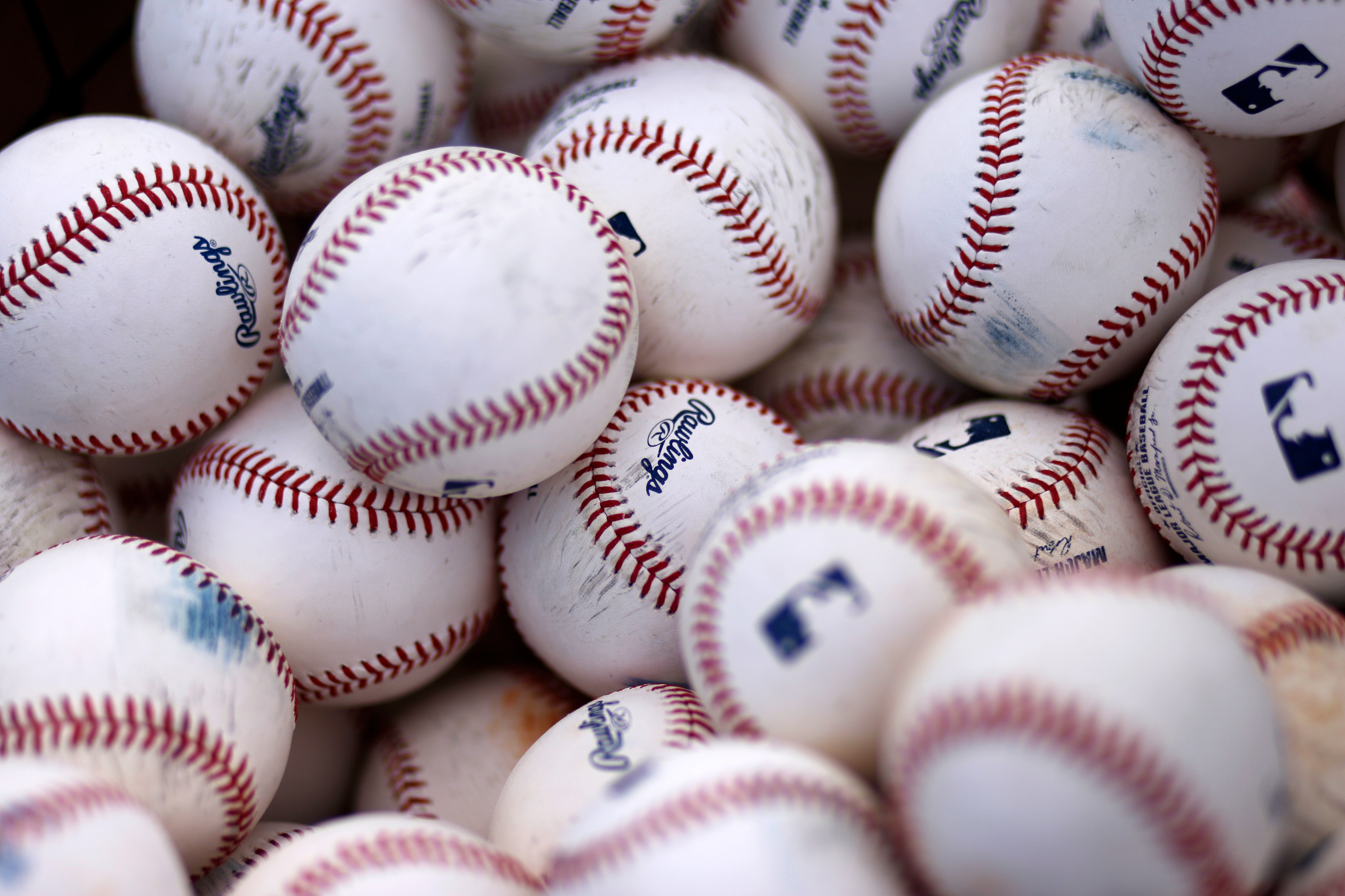 MLB buys Rawlings, seeking more control over baseball production