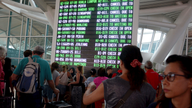The Latest: Flights trickle from Bali after airport reopens
