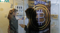 As Bitcoin, other currencies soar, regulators urge caution