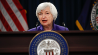 The Latest: China raises key policy rate after Fed's hike