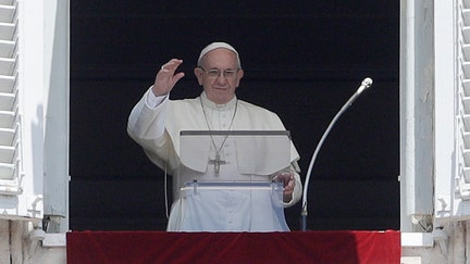 Pope Francis waves to faithful during the Angelus noon prayer in St. Peter's Square at the Vatican, Sunday, June 3, 2018. (AP Photo/Gregorio Borgia)
