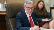 Fed officials discuss rate hikes that could slow growth