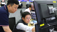 Asian shares mostly higher; Japan's Nikkei up on weak yen