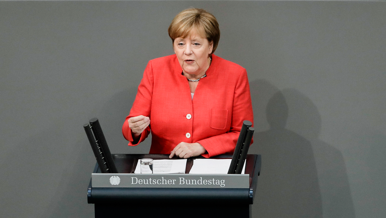 Germany’s Merkel, Hungary’s Orban clash over how to be humane