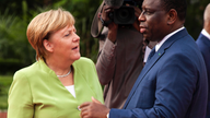 Merkel arrives for West Africa visit on business, migrants
