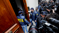 Argentine authorities carry out raids at Fernandez's homes