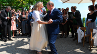 Putin dances at Austrian wedding; talks with Merkel on Syria