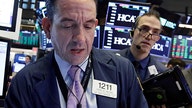 Dow flips from big gain to big loss after Trump announces more China tariffs