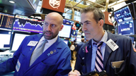 US stock indexes turn lower on renewed trade concerns