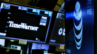 AT&T fires back in bid to preserve its deal with Time Warner