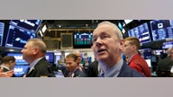 Dow surges on Fed rate decision, strong earnings
