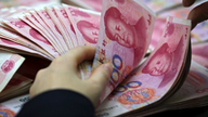 China's yuan sinks to 10-year low against dollar