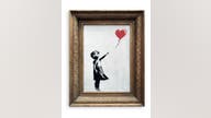 Banksy artwork self-destructs just after $1.4 million sale
