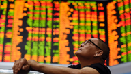 Asian shares turn lower after strong day on Wall Street