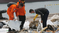 The Latest: Searchers find debris, belongings on seafloor