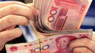 China's yuan sinks further after US currency report