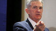 Powell sees potential threats from global slowdown