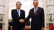 Chinese premier urges guard of free trade on Singapore visit