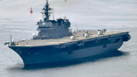 Japan to spend more on defense, refit first aircraft carrier