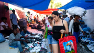 Cubans fly around the world hunting shopping bargains