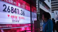 Asian shares skid as Huawei CFO arrest revives trade jitters